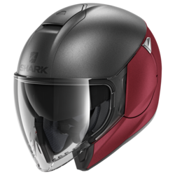Motorcycle jet  grey, red helmet 